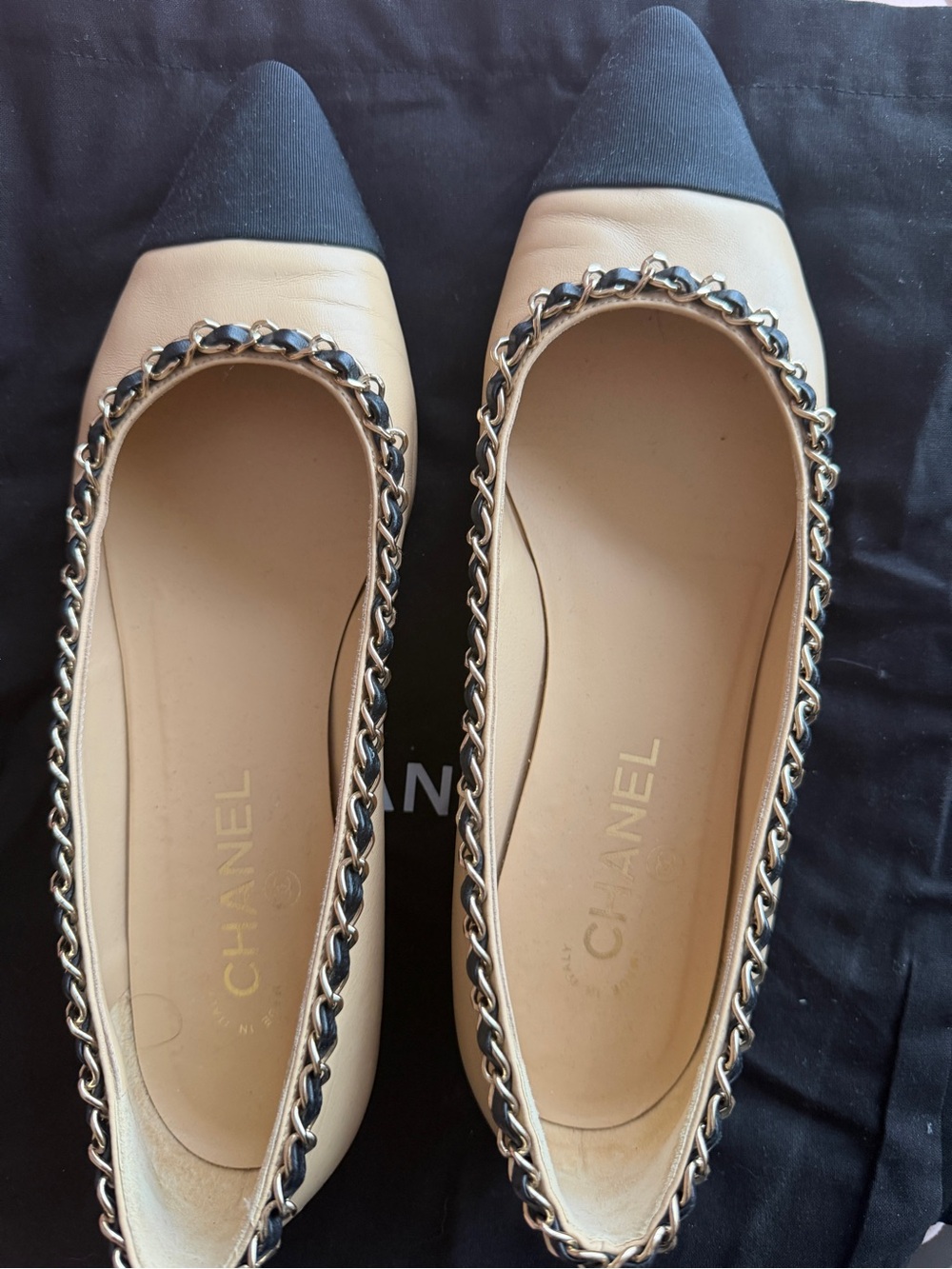 CHANEL Beige Leather Ballet Flats with Black Cap Toe and Chain Trim